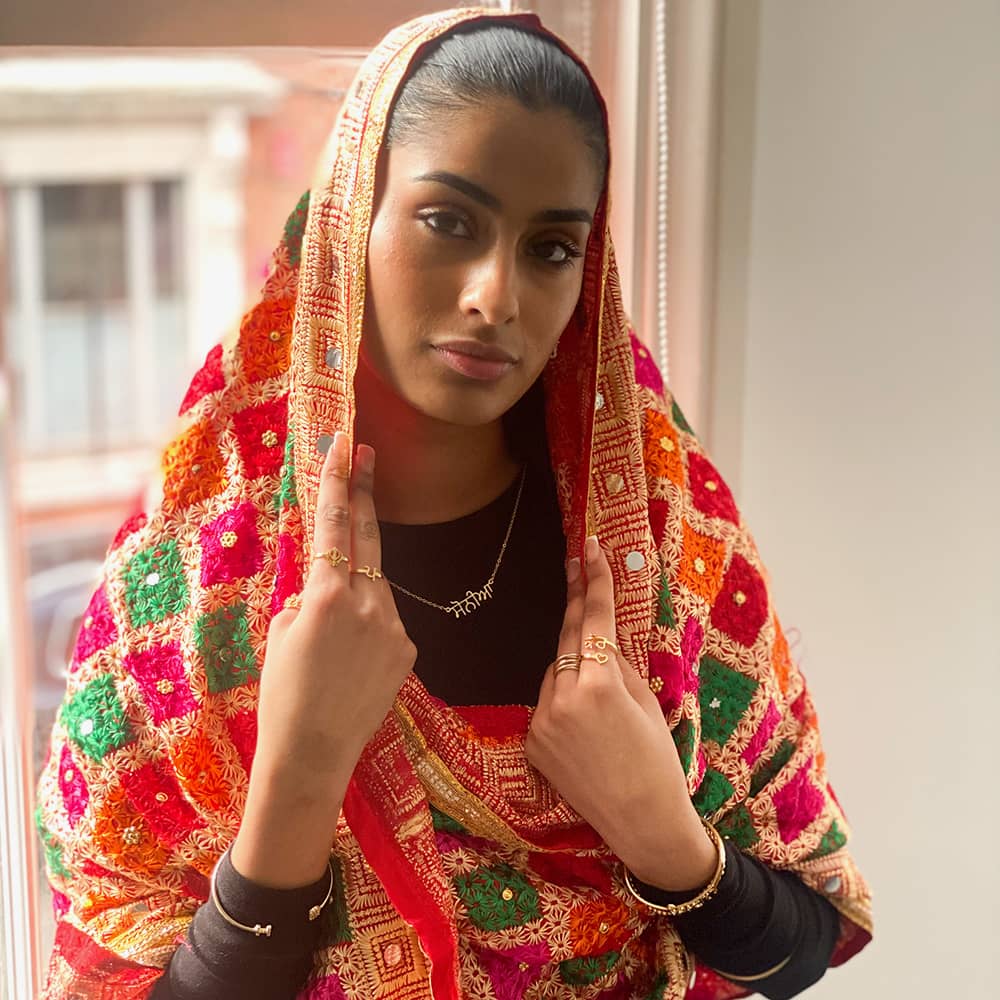 Eleisha wearing personalised name necklace in punjabi with phulkari chunni on head as punjabi attire
