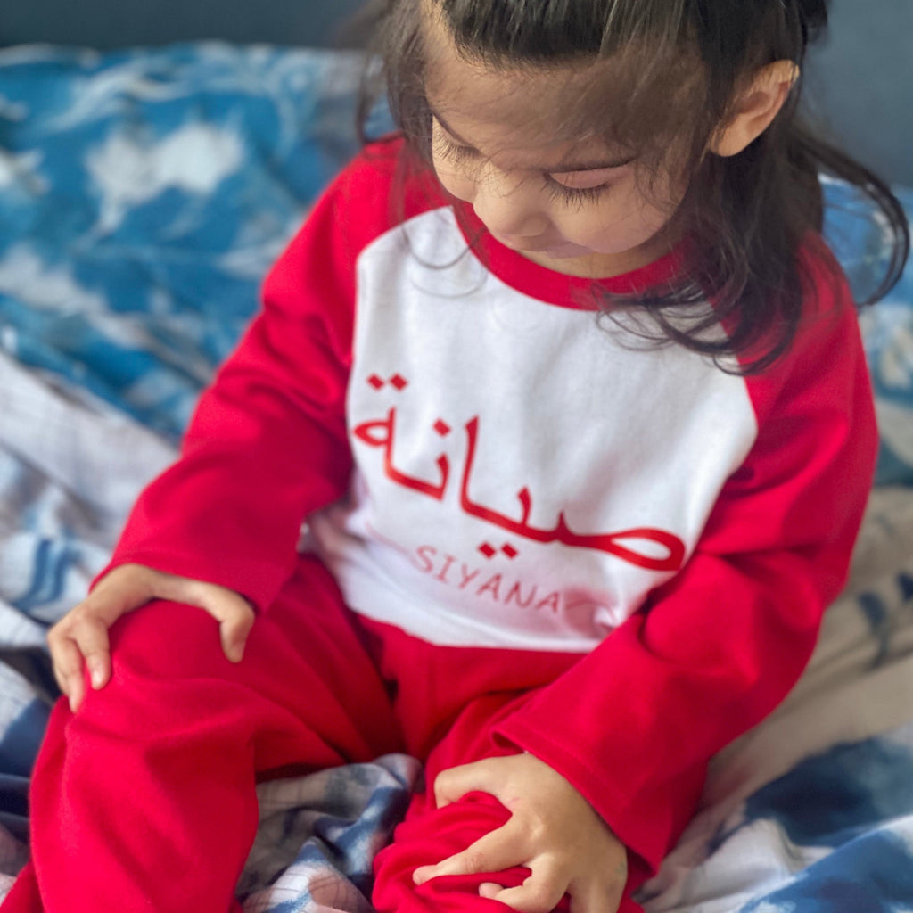 red kids pjs with personalised name in arabic and floral pyjamas design for girls