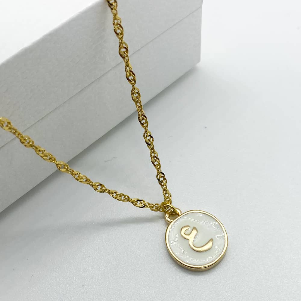 white enamel and 18ct gold plated initial pendant necklace with A or I in arabic