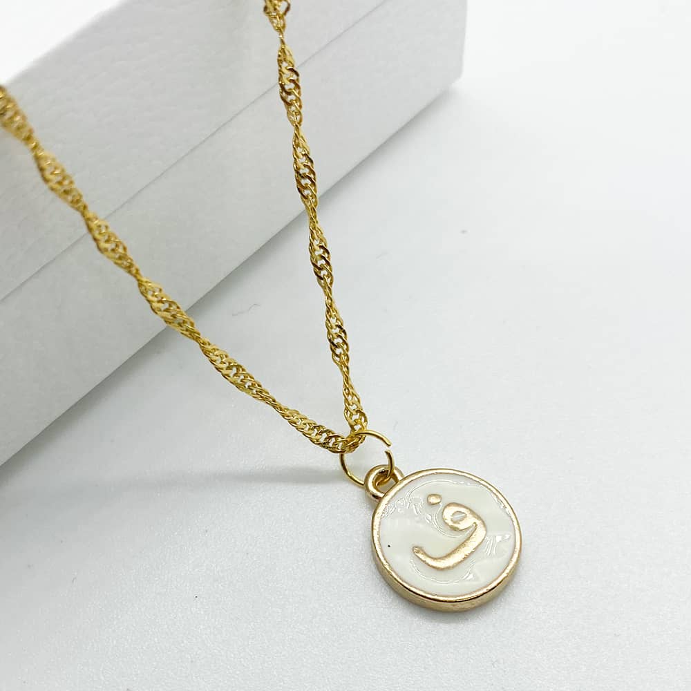 white enamel and 18ct gold plated initial pendant necklace with F in arabic