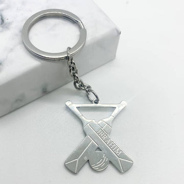 keychain design in silver for men with cricket bats and ball and custom name engraving in any language or name.