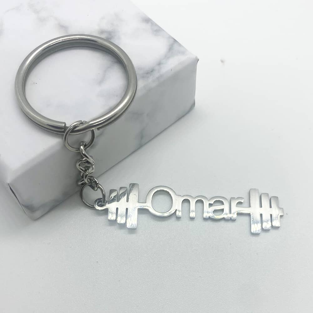 gym design keychain in silver for men of a dumbbell with custom name