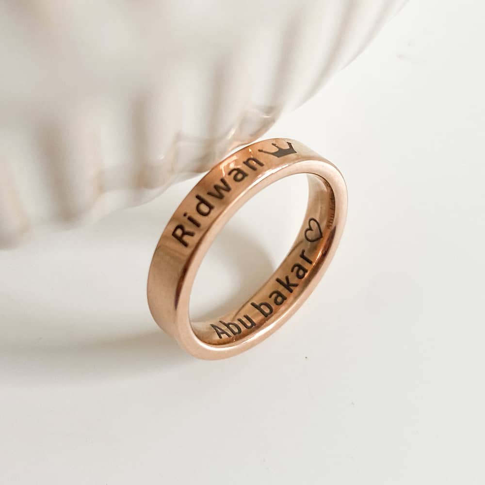 engraved band ring with name hidden inside and outside