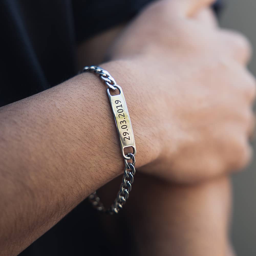 engraved bar bracelet worn by men engraved with anniversary date