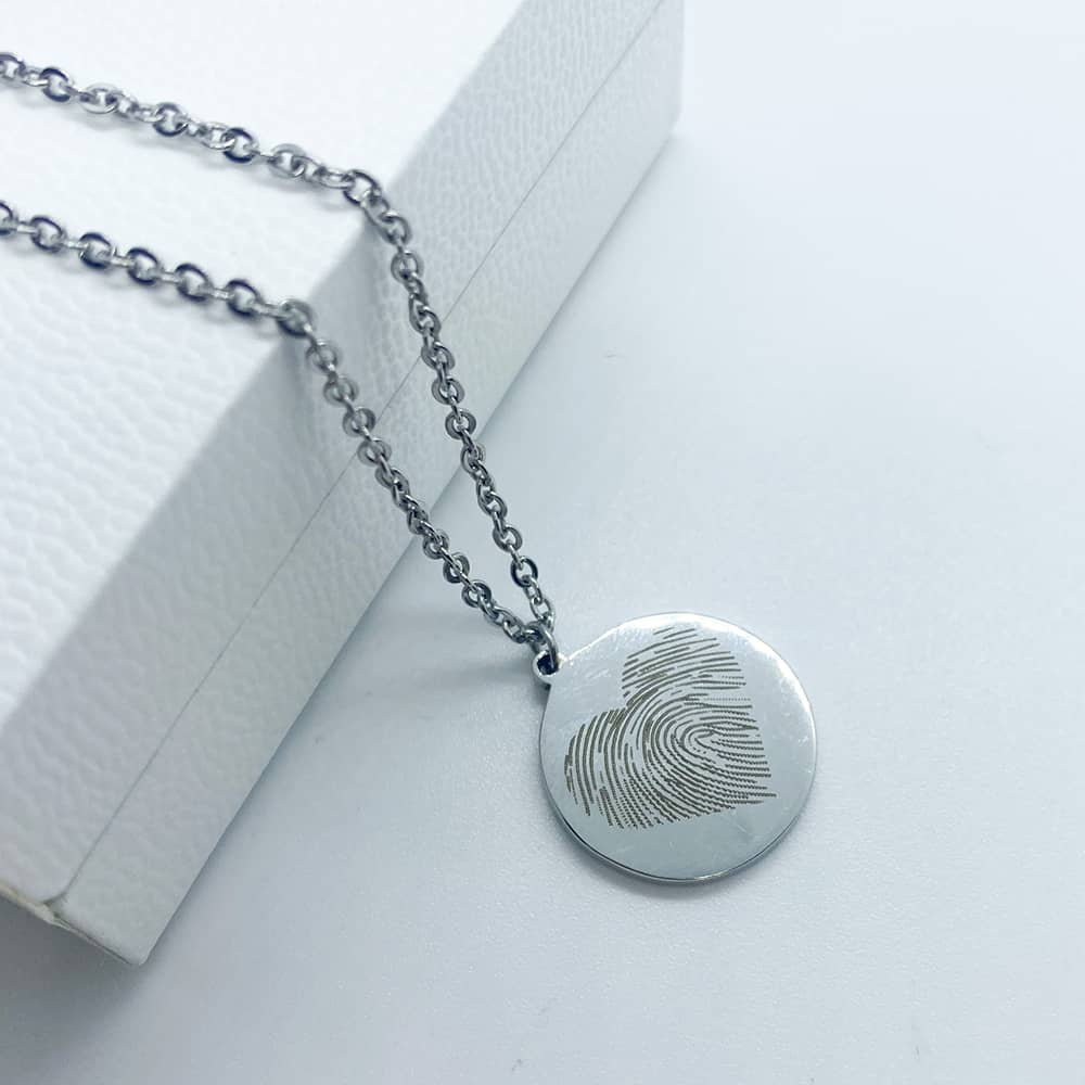 silver necklace with circle pendant and personalised engraved fingerprint