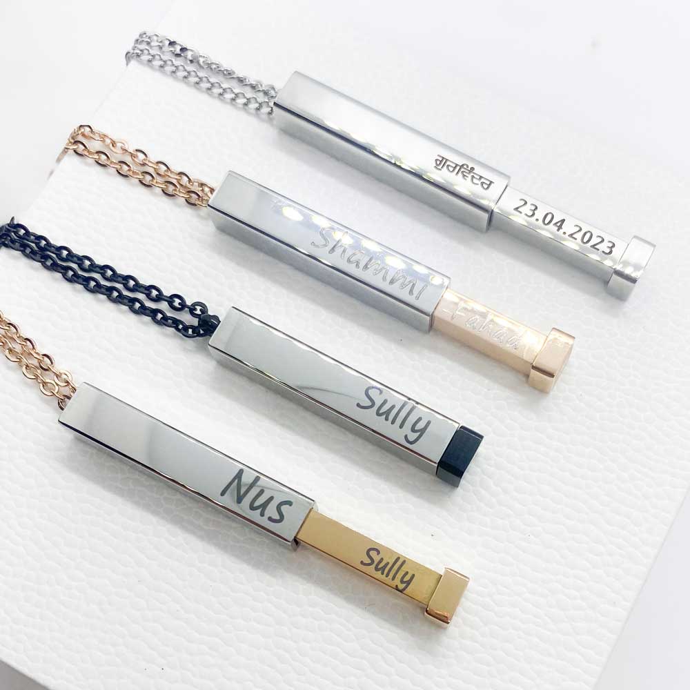 collection of engraved bar necklaces with hidden message inside with name engravings for couples