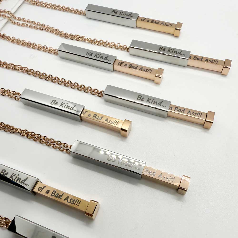 engraved necklace for women with engraved bar inside and outside reading be kind of a bad ass
