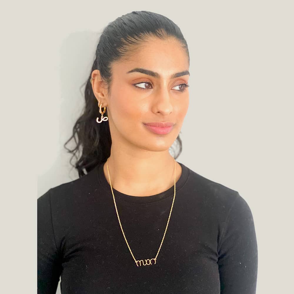 woman wearing malayalam name necklace in 18k gold plated