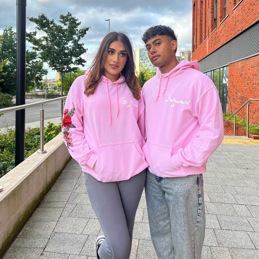 pink matching hoodies for couples with floral embroidery for woman and white urdu names