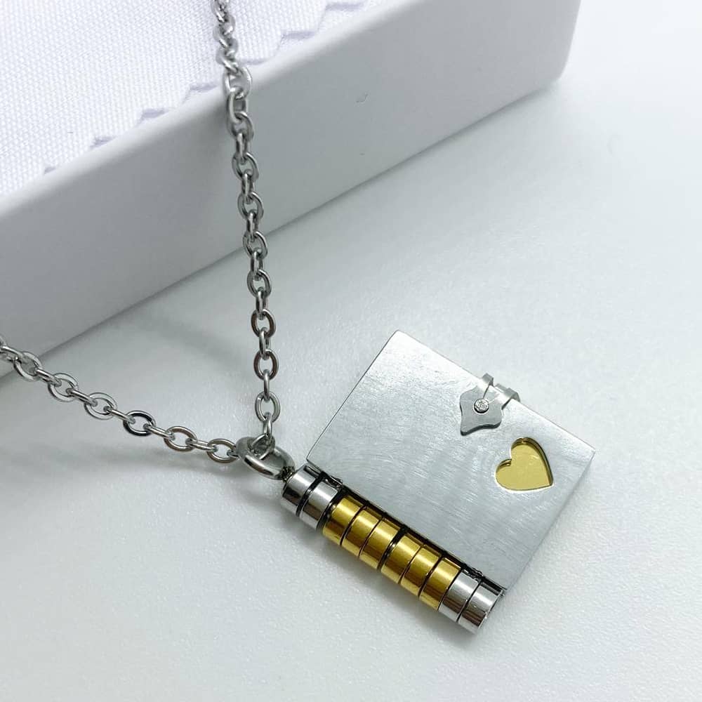 diary book necklace in 18ct gold plated with engraved messages