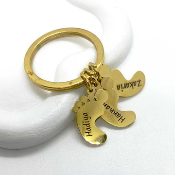 gold keychain with baby feet charms with kids names engraved as gift for mom