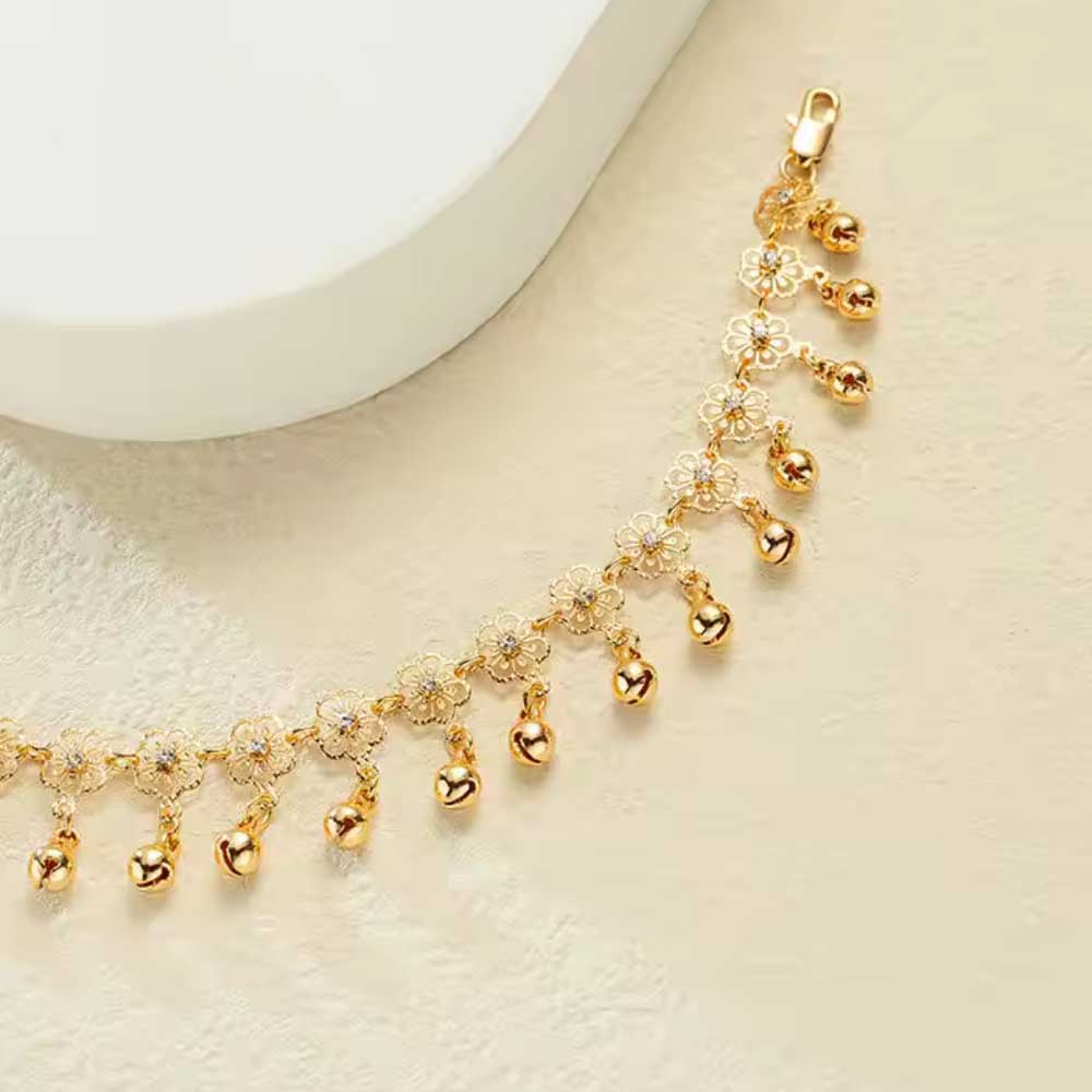 18ct gold plated anklet for women with bells and daisy flower on it