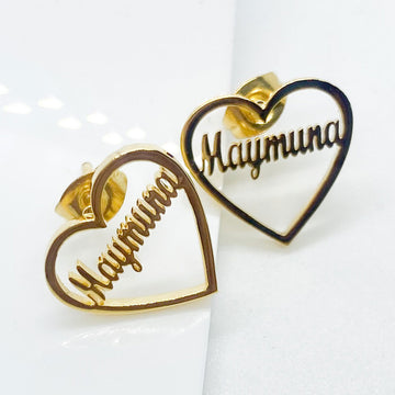 a pair of custom name earrings as a heart stud earrings with name in English