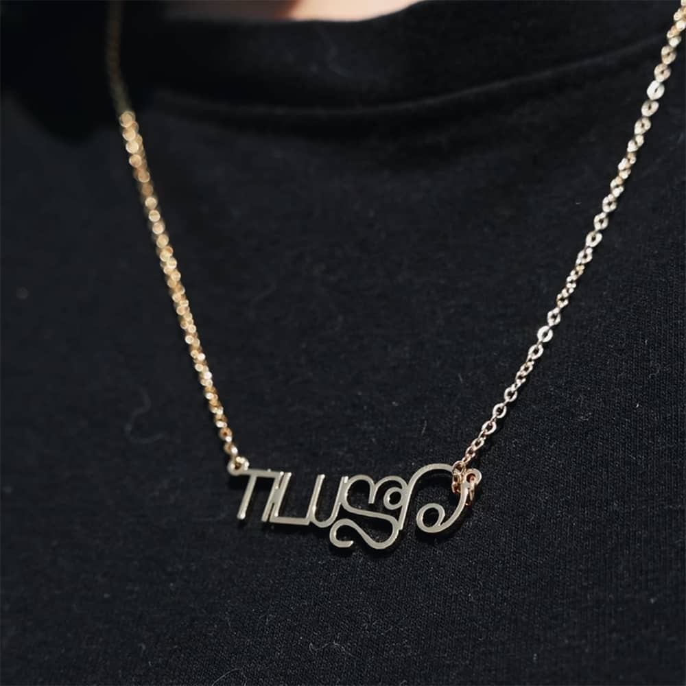 Model wearing personalised tamil name necklace