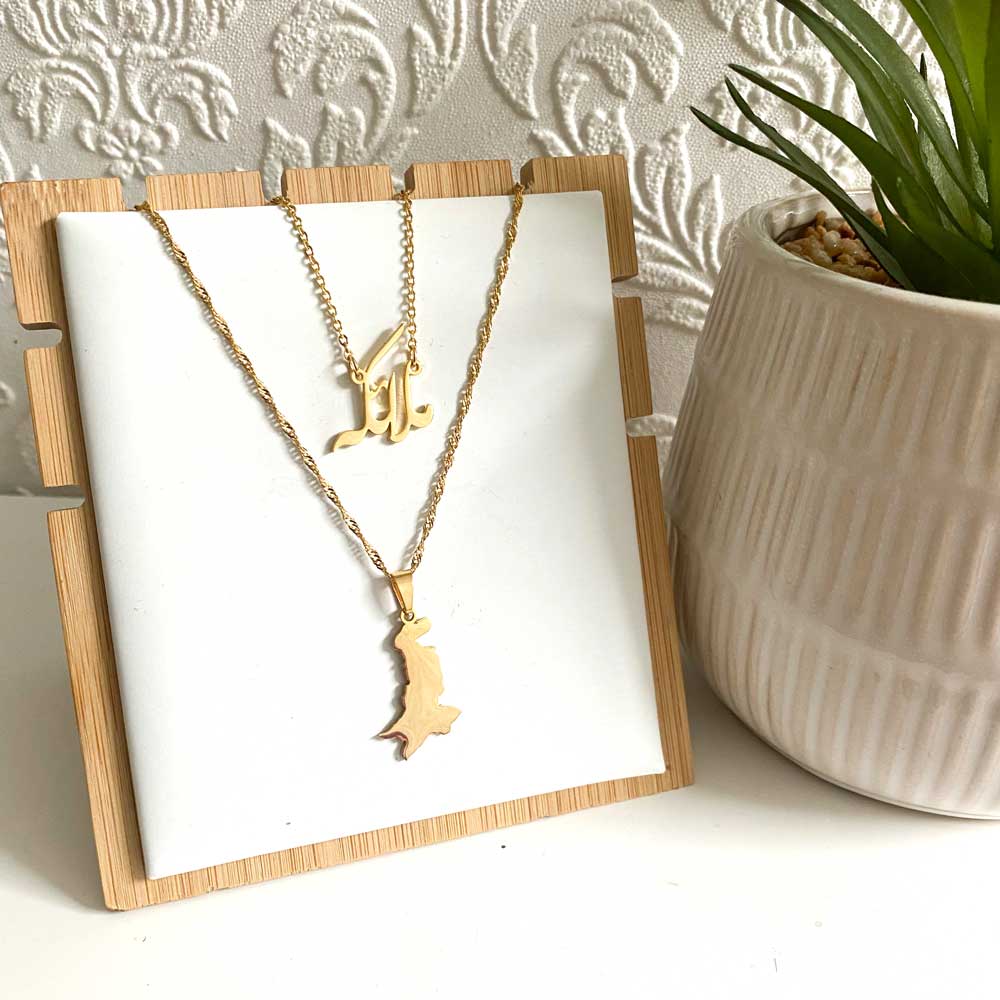 Gold Urdu name necklace with the name Malaika displayed alongside Pakistan map pendant necklace