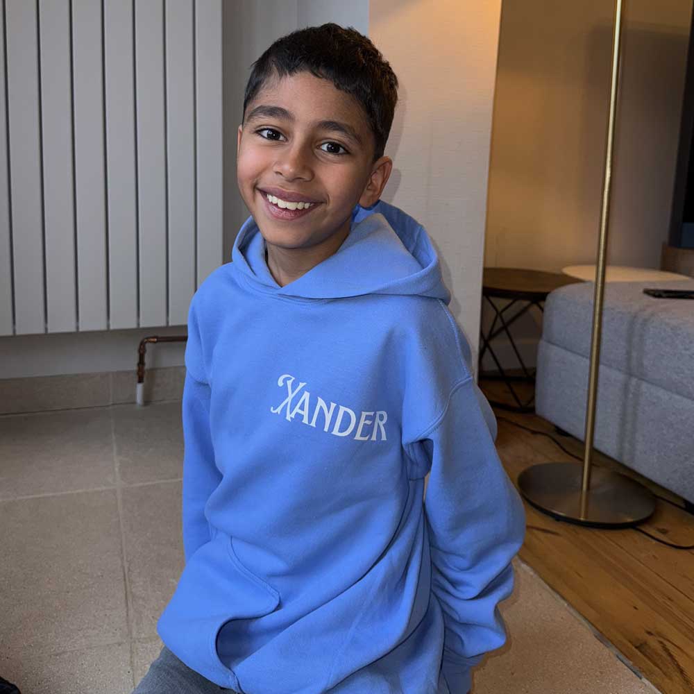 light blue personalised hoodie for boys with name in english in white print