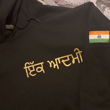 black hoodie with Punjabi name on left chest in metallic gold and India embroidered flag on sleeve