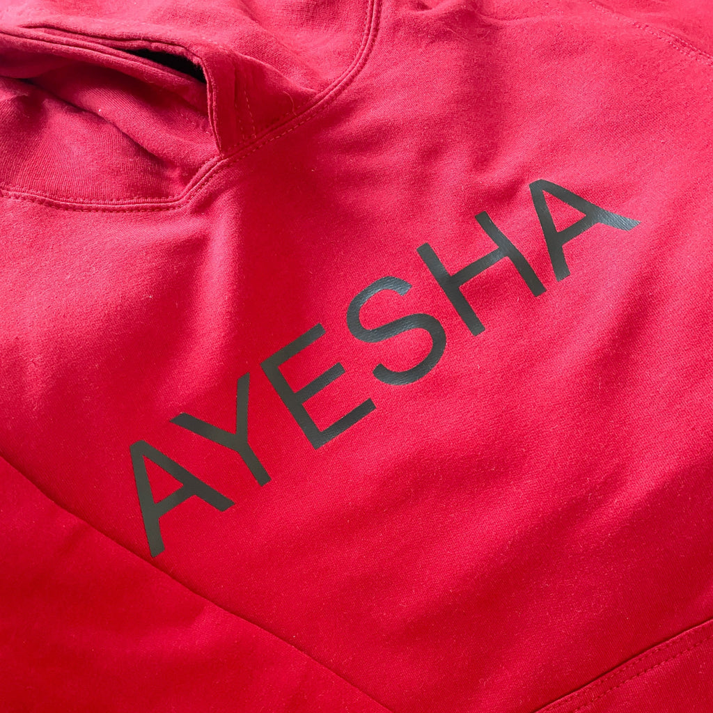 Customer Order Photo - red hoodie with black English name printed across the chest