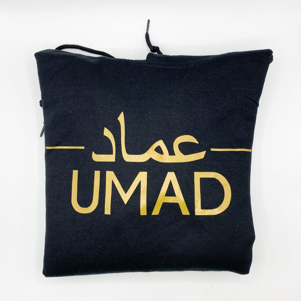 black hoodie with metallic gold design of Arabic and English name